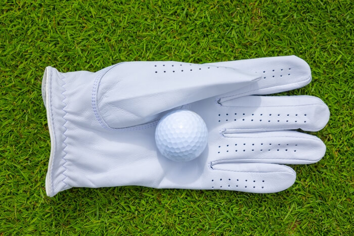 high-angle-closeup-of-a-golf-ball-in-a-glove-on-th-2025-02-02-13-54-44-utc (1)